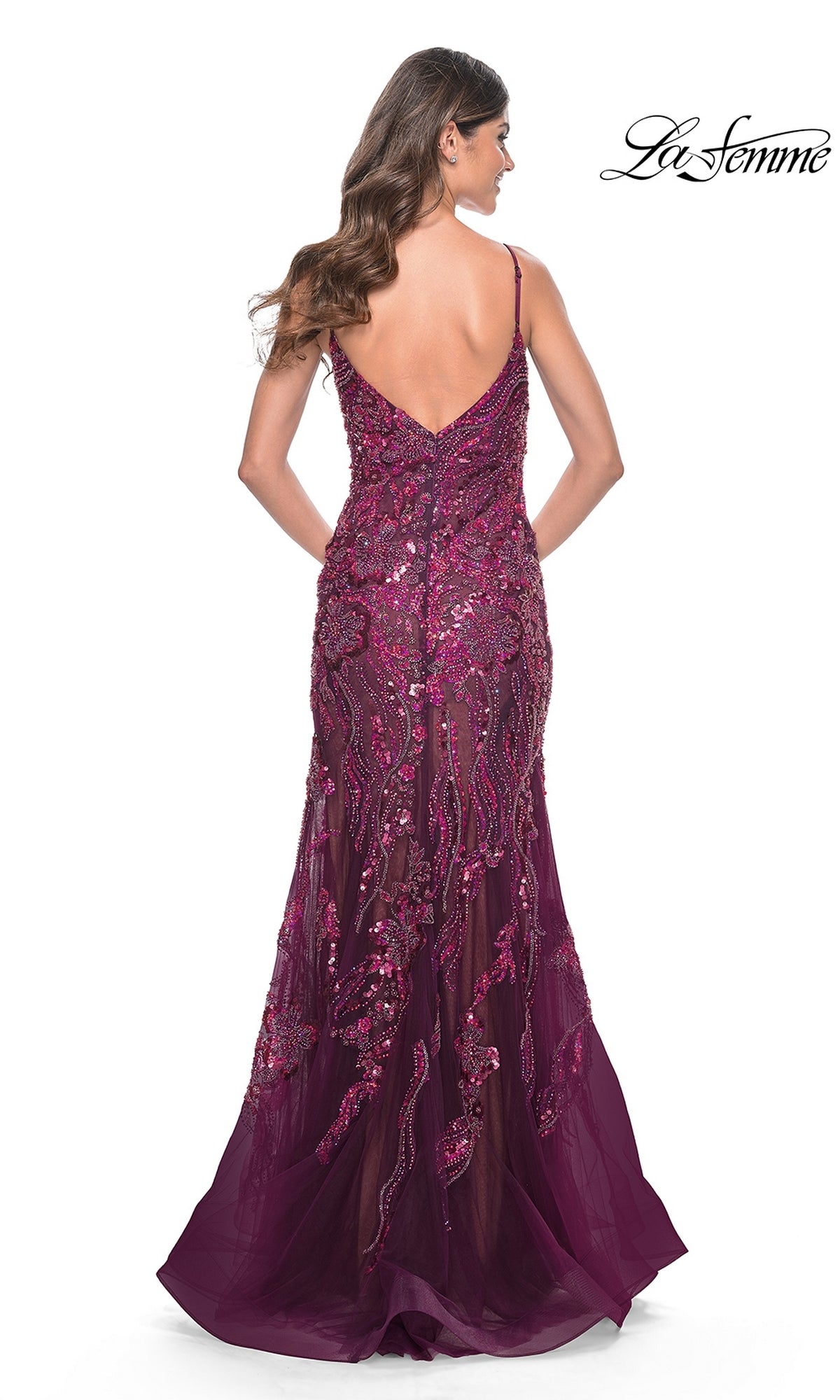A woman with long hair faces away, wearing the Le Femme Sequin-Lace Long Mermaid Prom Dress 32049—a sleeveless deep burgundy gown with a low back. The La Femme logo appears in the top right corner.